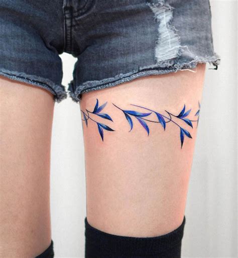 around the thigh tattoos|simple thigh tattoo ideas.